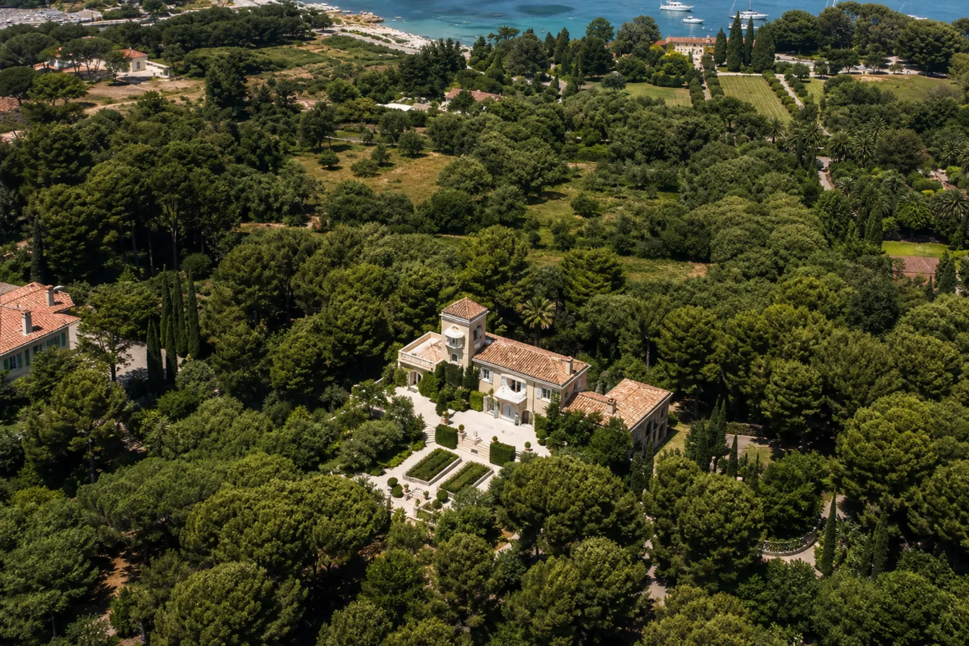 Aerial view of Villa Le Clocher and its gardens near Garoupe Bay